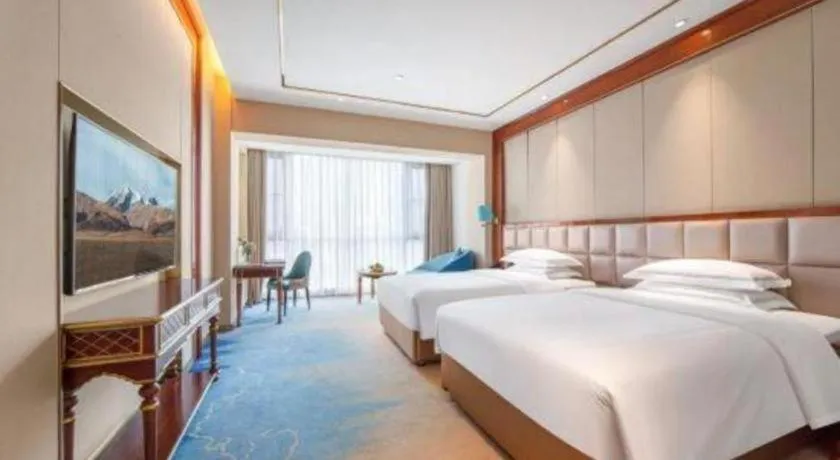 Bed in Vienna Hotel Yunnan Maitreya Huquan