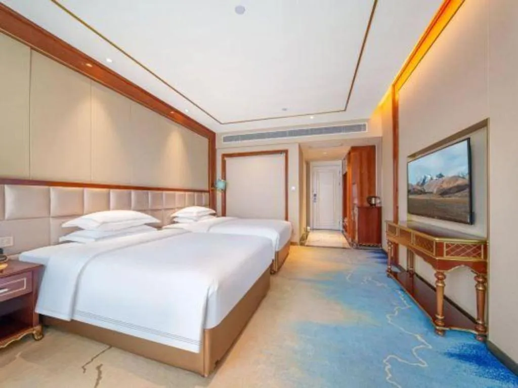 Bed in Vienna Hotel Yunnan Maitreya Huquan