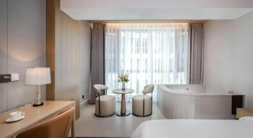 Bed in Vienna Hotel Yunnan Maitreya Huquan