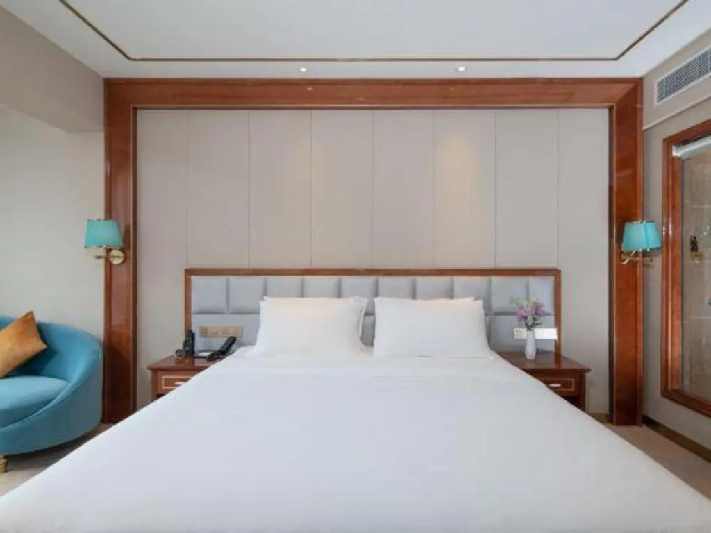 Bed in Vienna Hotel Yunnan Maitreya Huquan