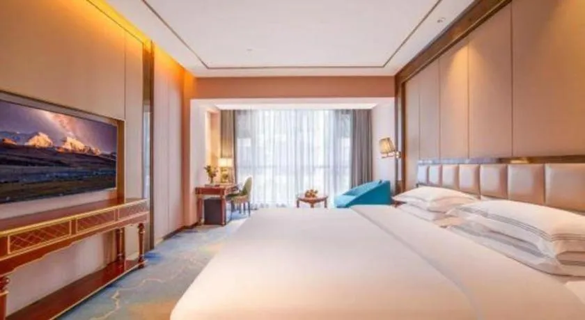 Bed in Vienna Hotel Yunnan Maitreya Huquan