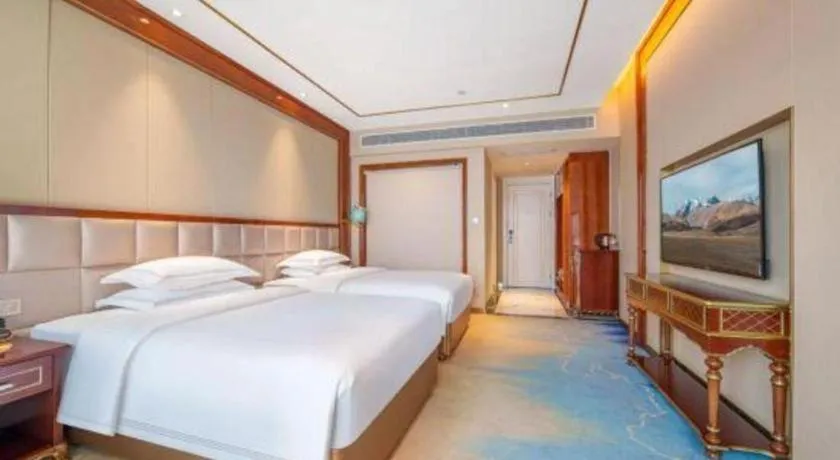 Bed in Vienna Hotel Yunnan Maitreya Huquan