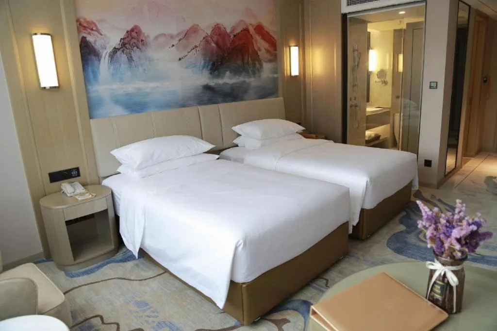 Bed in Venus Royal Hotel Guangdong Zhongshan Dongfeng Center