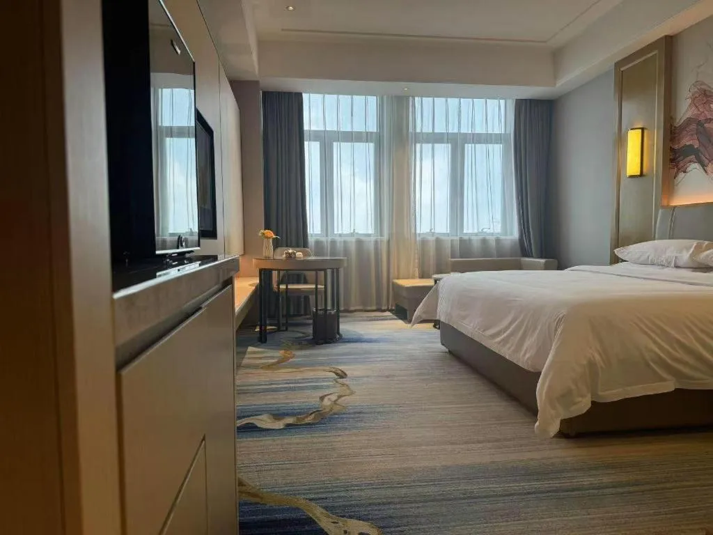 Bed in Venus Royal Hotel Guangdong Zhongshan Dongfeng Center