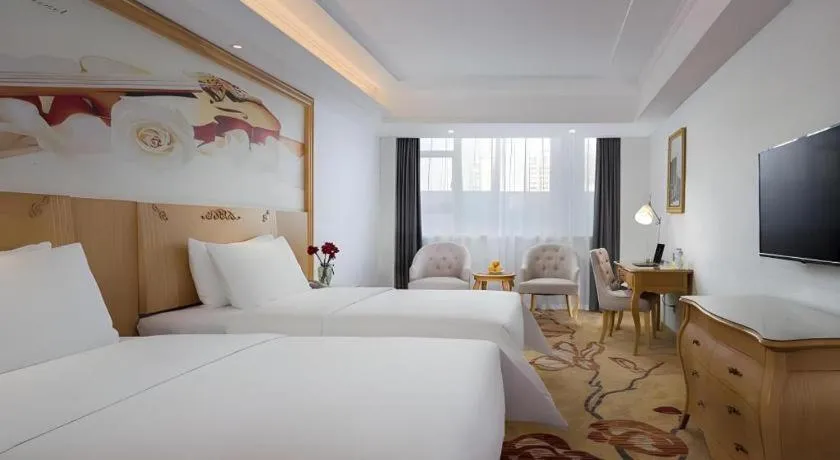 Bed in Vienna Hotel Guangdong Huizhou Huabianling Square