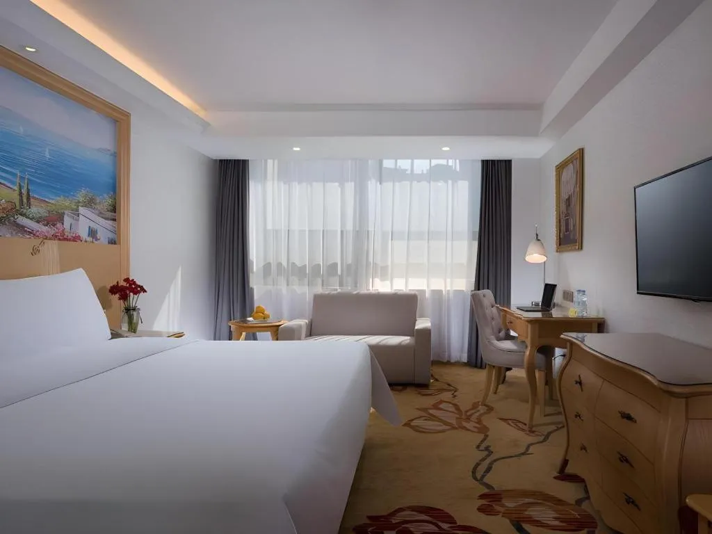 Bed in Vienna Hotel Guangdong Huizhou Huabianling Square