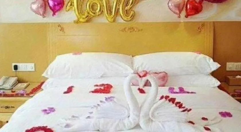 Bed in Vienna Hotel Guangxi Yulin Rong County Guinan Road