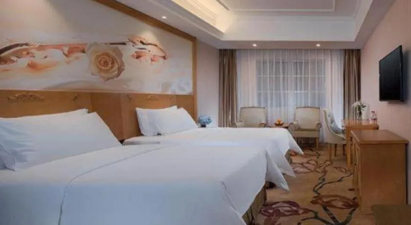 Bed in Vienna Hotel Guangxi Yulin Rong County Guinan Road