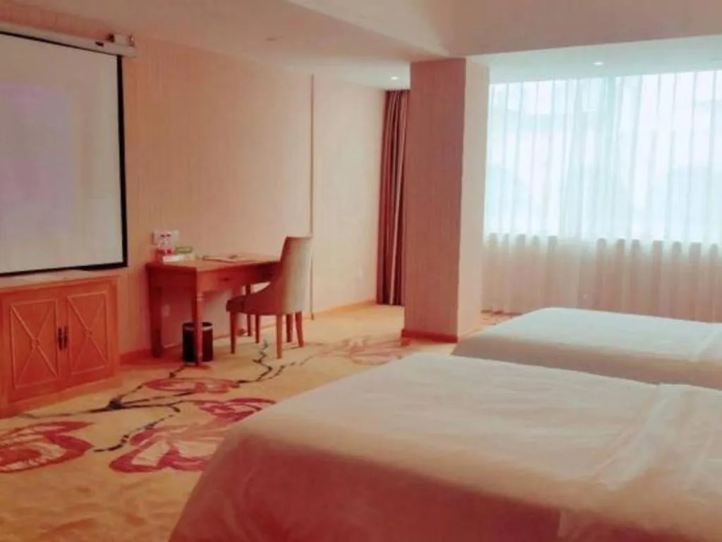 Bed in Vienna Hotel Guangxi Yulin Rong County Guinan Road