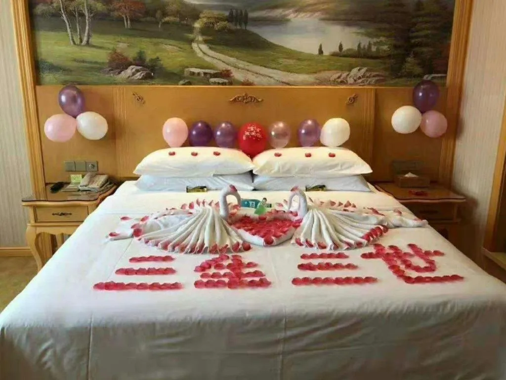 Bed in Vienna Hotel Guangxi Yulin Rong County Guinan Road