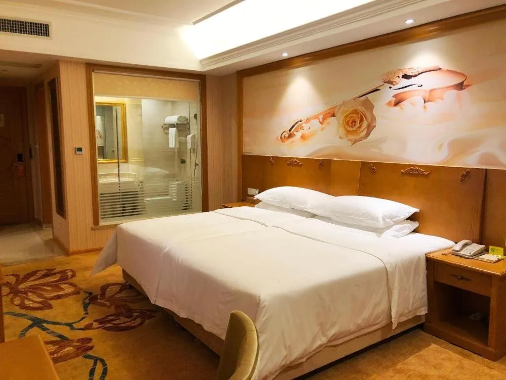 Bed in Vienna Hotel Guangxi Yulin Rong County Guinan Road
