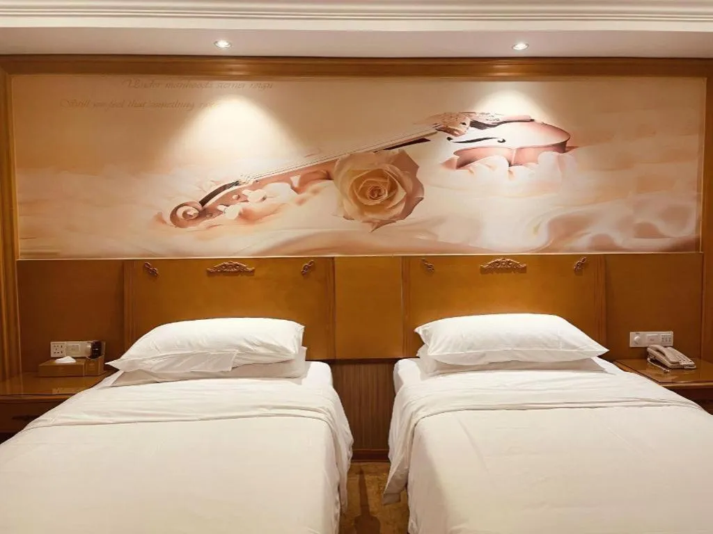 Bed in Vienna Hotel Guangxi Yulin Rong County Guinan Road