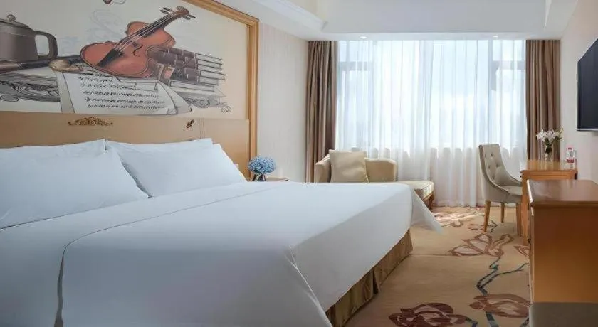 Bed in Vienna Hotel Guangxi Yulin Rong County Guinan Road