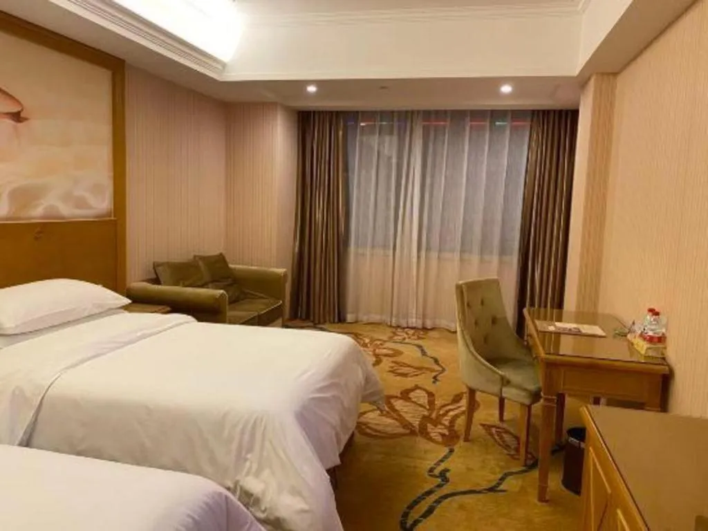 Bed in Vienna Hotel Guangxi Yulin Rong County Guinan Road