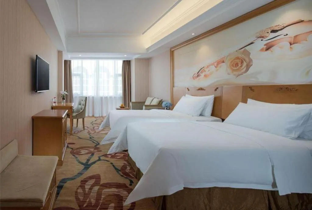 Bed in Vienna Hotel Guangxi Yulin Rong County Guinan Road