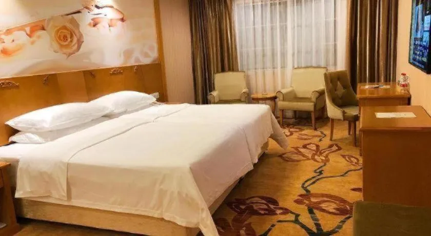Bed in Vienna Hotel Guangxi Yulin Rong County Guinan Road