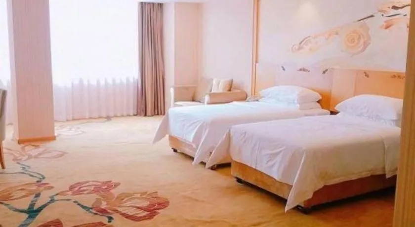 Bed in Vienna Hotel Guangxi Yulin Rong County Guinan Road