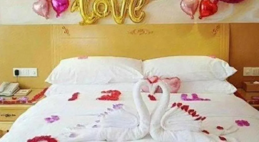 Bed in Vienna Hotel Guangxi Yulin Rong County Guinan Road