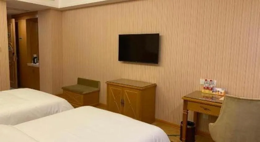Bed in Vienna Hotel Guangxi Yulin Rong County Guinan Road