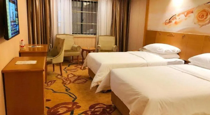 Bed in Vienna Hotel Guangxi Yulin Rong County Guinan Road