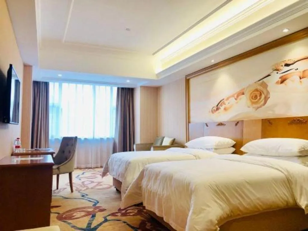 Bed in Vienna Hotel Guangxi Yulin Rong County Guinan Road