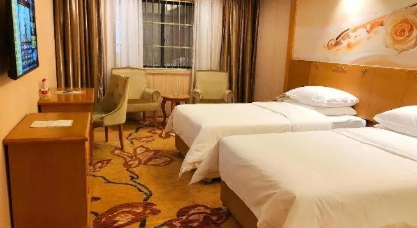 Bed in Vienna Hotel Guangxi Yulin Rong County Guinan Road