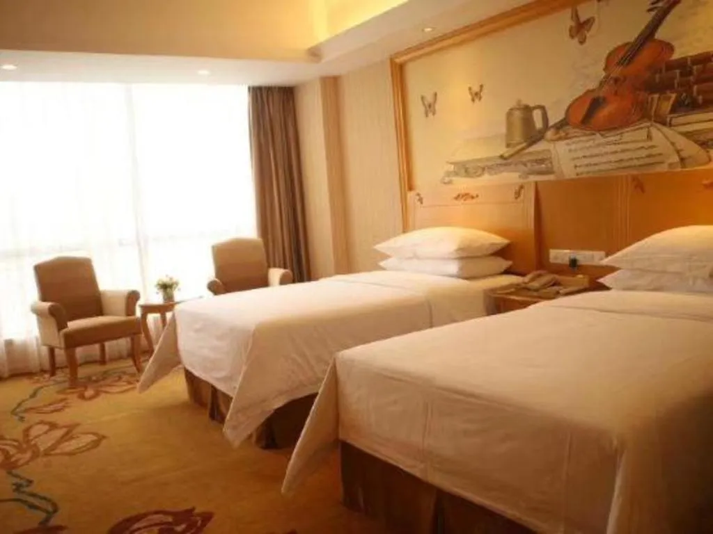 Bed in Vienna Hotel Guangxi Yulin Rong County Guinan Road