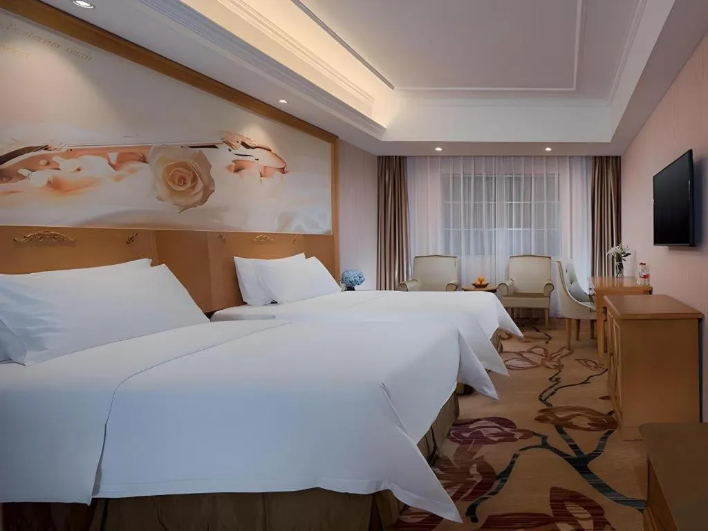 Bed in Vienna Hotel Guangxi Yulin Rong County Guinan Road