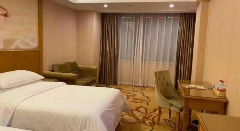 Bed in Vienna Hotel Guangxi Yulin Rong County Guinan Road