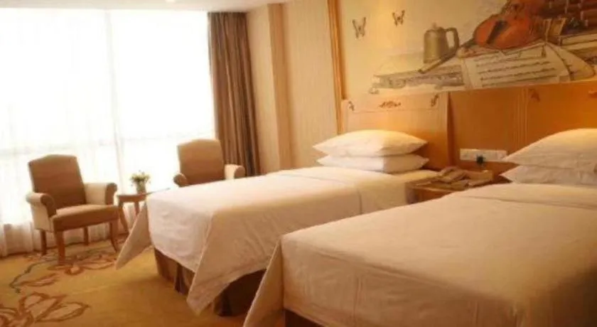 Bed in Vienna Hotel Guangxi Yulin Rong County Guinan Road