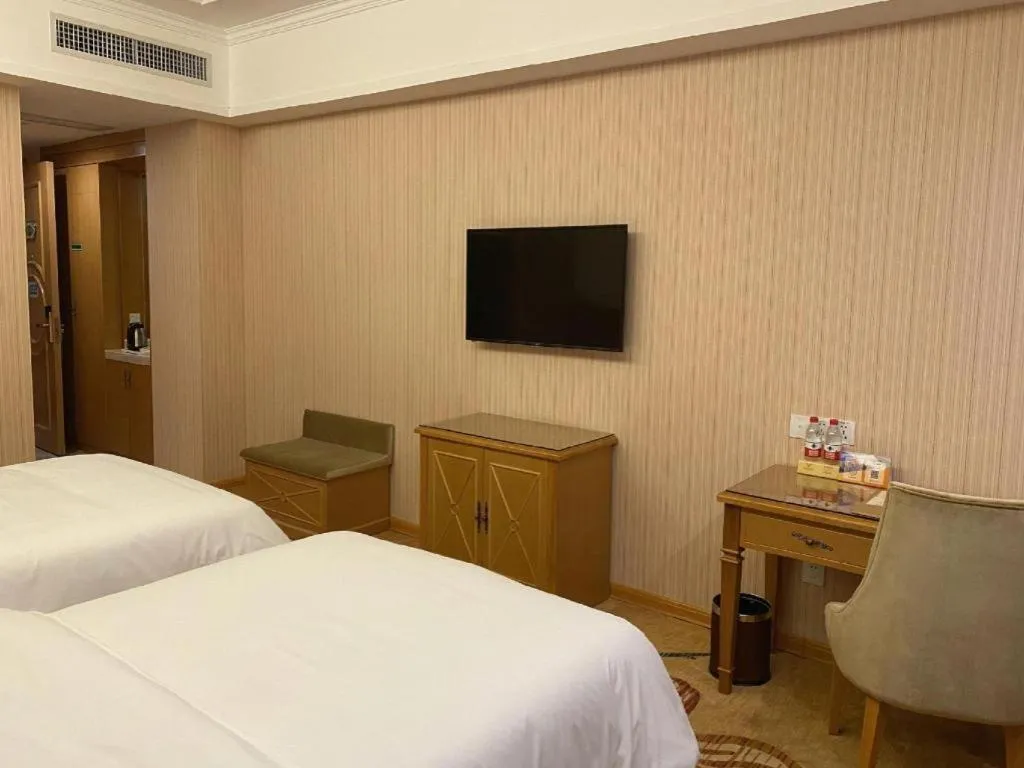 Bed in Vienna Hotel Guangxi Yulin Rong County Guinan Road