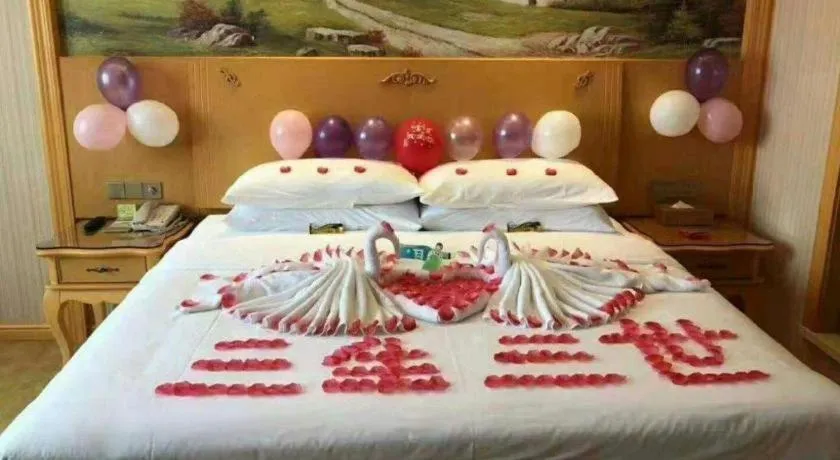 Bed in Vienna Hotel Guangxi Yulin Rong County Guinan Road