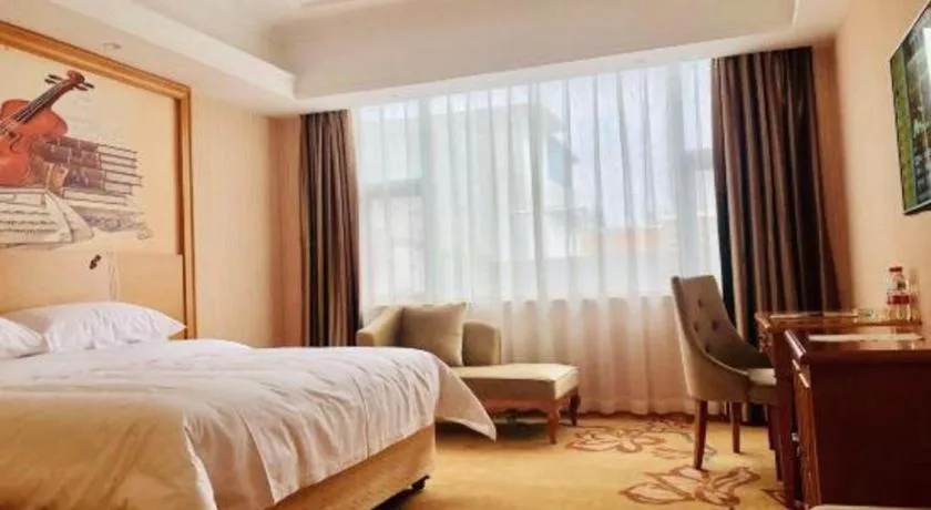 Bed in Vienna Hotel Guangxi Yulin Rong County Guinan Road