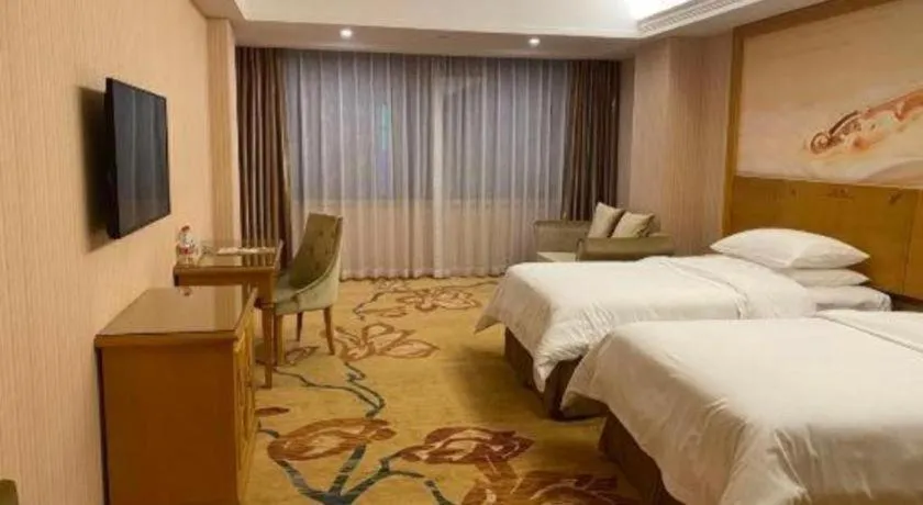 Bed in Vienna Hotel Guangxi Yulin Rong County Guinan Road