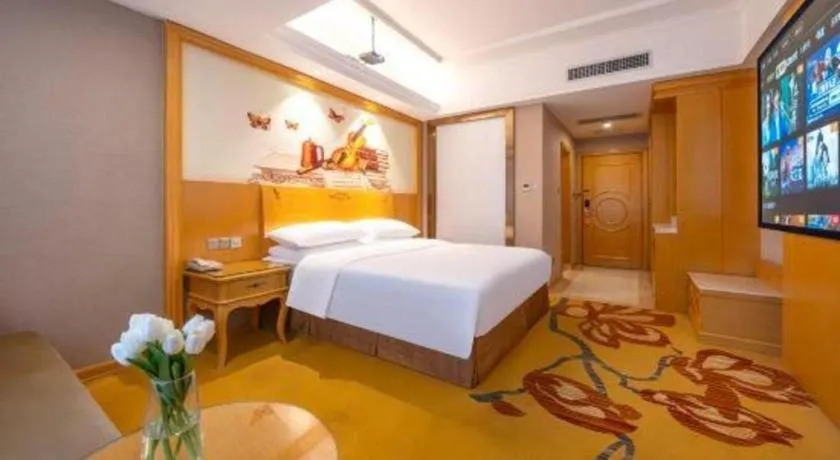 Bed in Vienna Hotel Guangxi Fangcheng