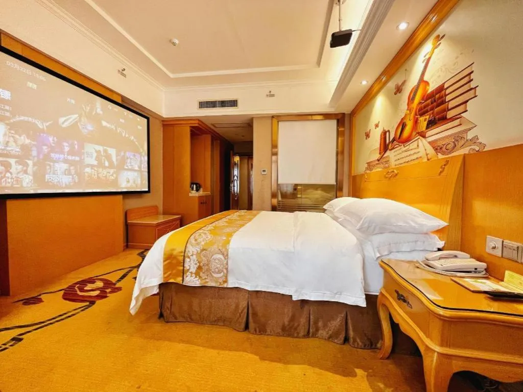 Bed in Vienna Hotel Guangxi Fangcheng