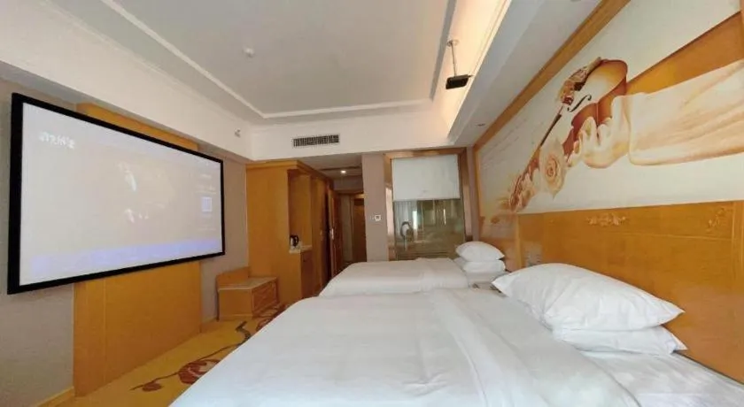 Bed in Vienna Hotel Guangxi Fangcheng