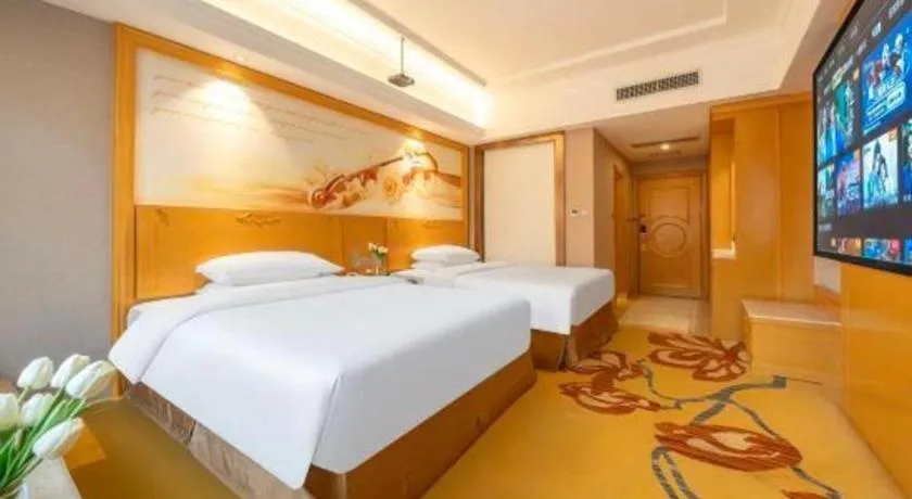 Bed in Vienna Hotel Guangxi Fangcheng