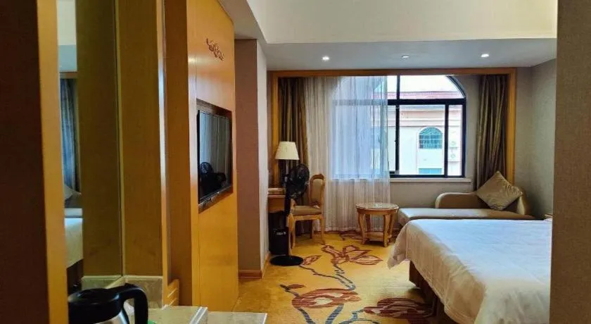 Bed in Vienna Hotel Guangxi Fangcheng