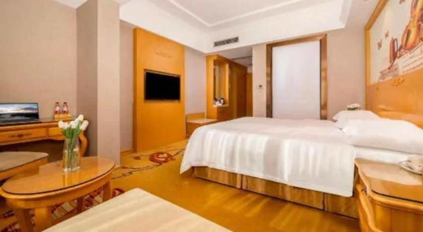 Bed in Vienna Hotel Guangxi Fangcheng