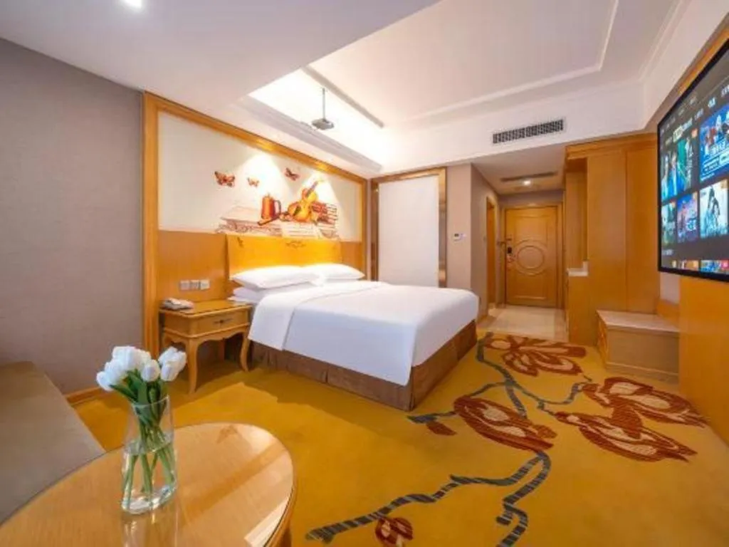 Bed in Vienna Hotel Guangxi Fangcheng