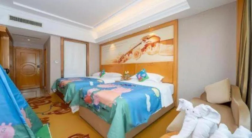 Bed in Vienna Hotel Guangxi Fangcheng