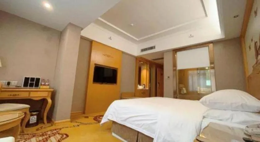 Bed in Vienna Hotel Guangxi Fangcheng