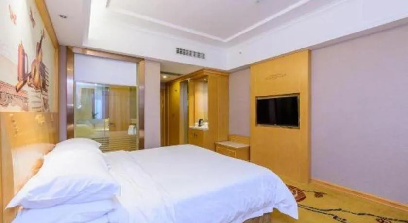 Bed in Vienna Hotel Guangxi Fangcheng