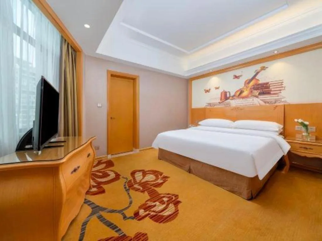 Bed in Vienna Hotel Guangxi Fangcheng
