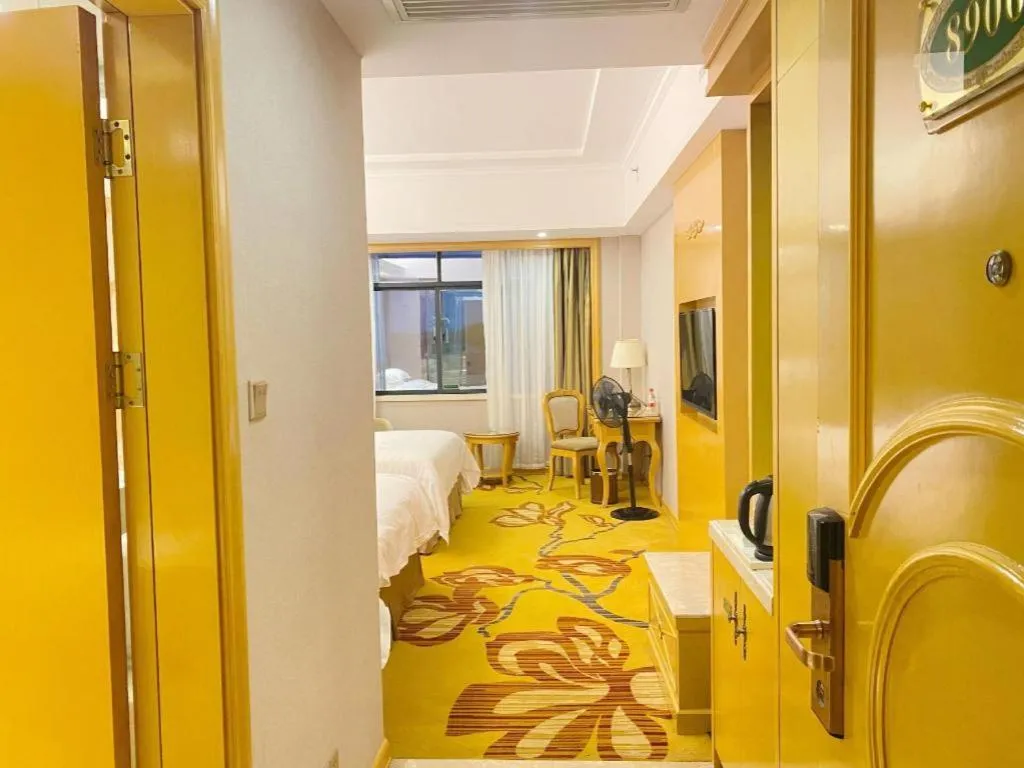 Bed in Vienna Hotel Guangxi Fangcheng