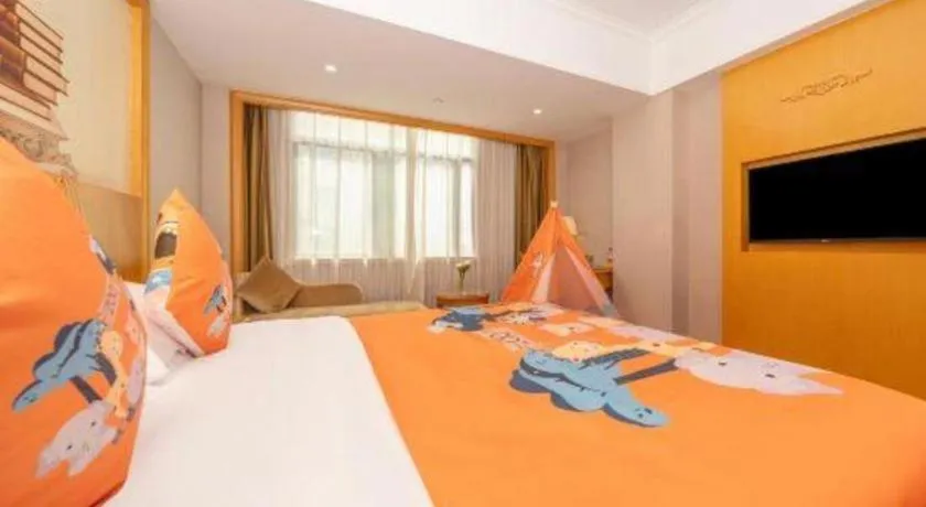 Bed in Vienna Hotel Guangxi Fangcheng