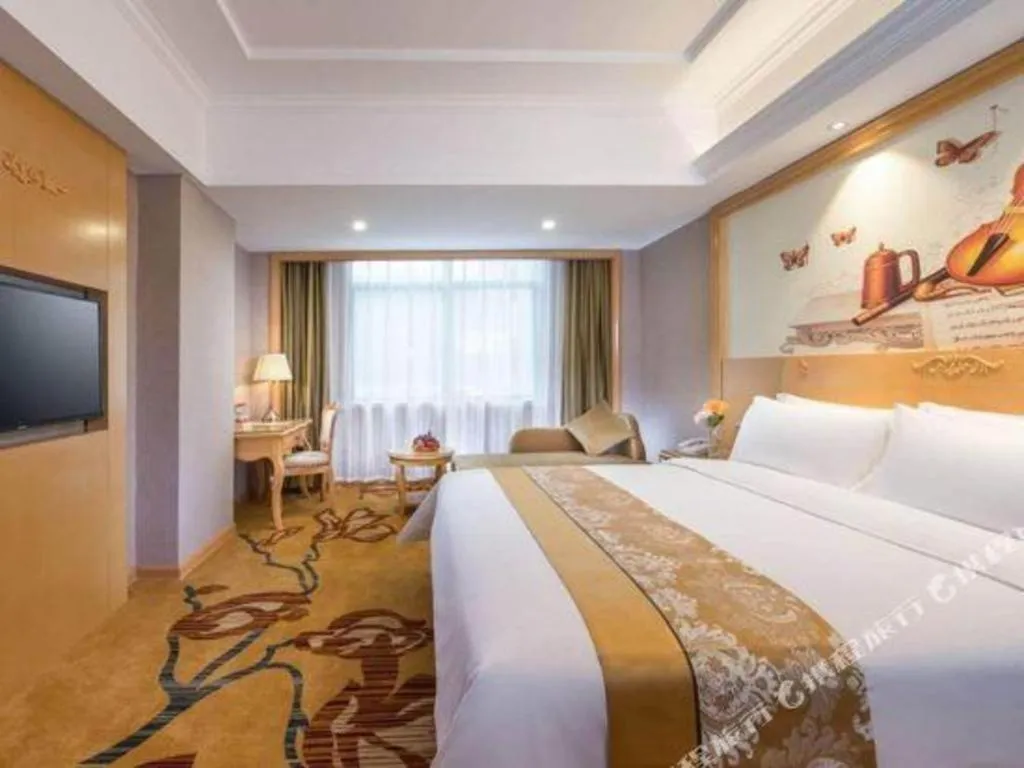 Bed in Vienna Hotel Guangxi Fangcheng