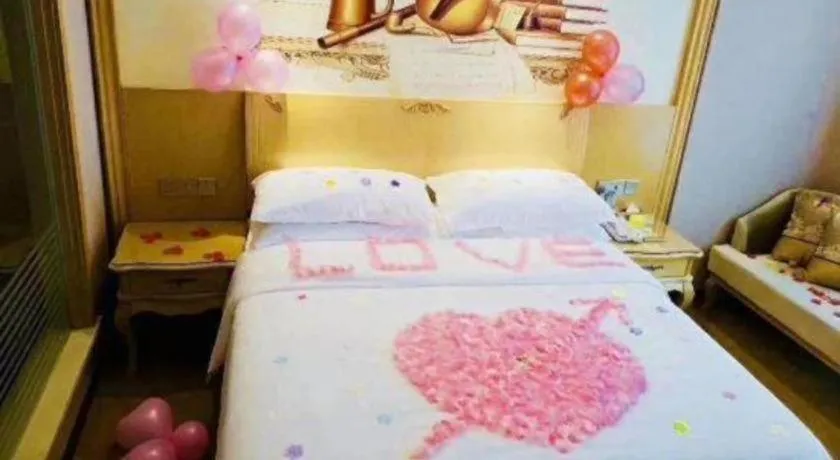 Bed in Vienna Hotel Guangxi Fangcheng