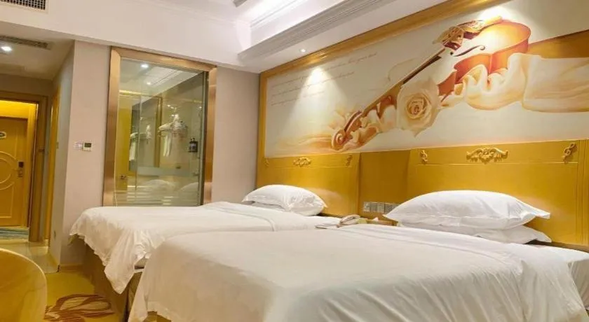 Bed in Vienna Hotel Guangxi Fangcheng